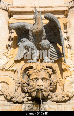 Ornate sandstone fountain, located in St George's Square, Misrah San George or Palace Square, in Valletta. Stock Photo