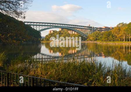 Henry Hudson Bridge in Inwood Hills Park spans the Harlem Shipping Canal which separates Manhattan from the Bronx. Stock Photo