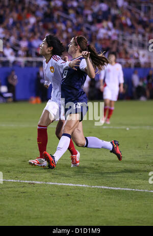 BOCA RATON, FL - DECEMBER 15: Alex Morgan #13 of the USA fights for position against China at FAU Stadium on December 15th, 2012 in Boca Raton, Florida The USA defeated China 4-1. Photo by Mauricio Paiz Stock Photo