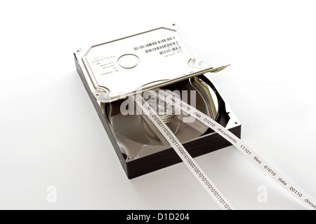 Half open hard drive and and a tape with the contents of the drive Stock Photo