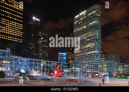 Tower Coeur Défense and headquarter of oil company TOTAL in the financial district La Défense in Paris at night Stock Photo