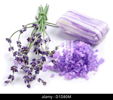 Bunch of lavender, soap and sea salt on a white background. Stock Photo