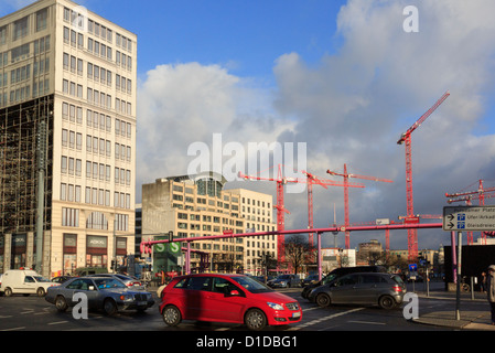 Busy road with cranes in new development on former death strip at Potsdamer Platz, Berlin, Germany Stock Photo