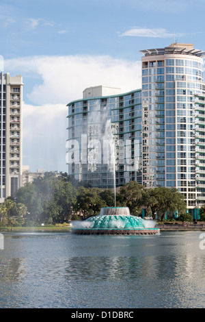 Modern high-rise buildings behind fountain in Lake Eola in downtown Orlando, Florida Stock Photo