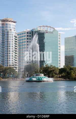 Modern high-rise buildings behind fountain in Lake Eola in downtown Orlando, Florida Stock Photo