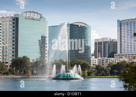 Modern high-rise buildings behind fountain in Lake Eola in downtown Orlando, Florida Stock Photo