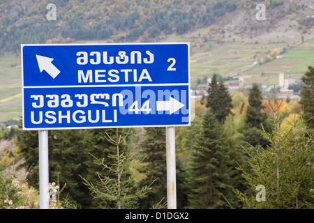 Road sign in Georgian and Latin writing near Mestia, Georgia Stock Photo