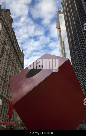 Isamu Noguchi's 28-foot tall piece of public art Red Cube  in the plaza by HSBC at 140 Broadway in the Financial District, NYC Stock Photo