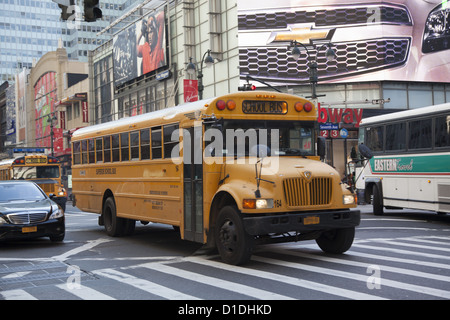 School bus driving through midtown Manhattan. Stock Photo