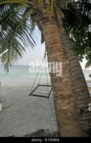hammock chair on a tropical Maldives beach Stock Photo