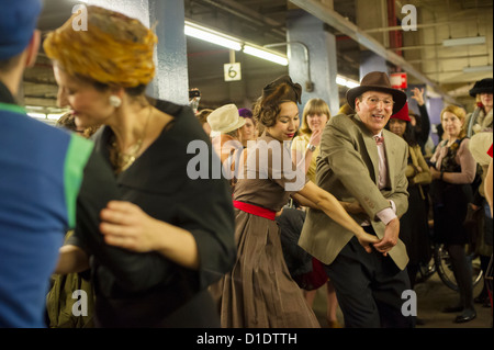 New Yorkers, tourists and subway buffs, some in period garb, travel on a vintage MTA Nostalgia Train Christmas season ride Stock Photo