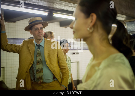 New Yorkers, tourists and subway buffs, some in period garb, travel on a vintage MTA Nostalgia Train Christmas season ride Stock Photo