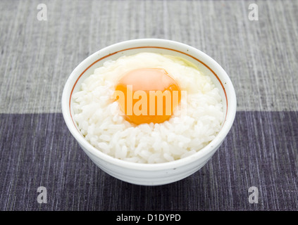 Raw egg sauce over rice Stock Photo