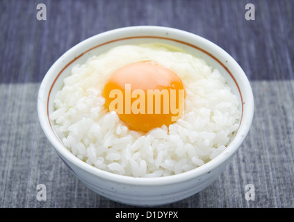 Raw egg sauce over rice Stock Photo