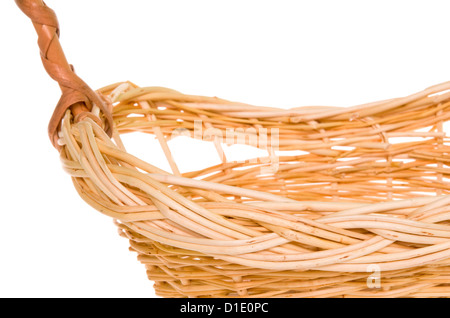 Natural willow woven basket isolated on white background with focus on front border Stock Photo