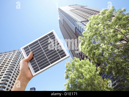 High-rise condominiums and a solar panel Stock Photo - Alamy