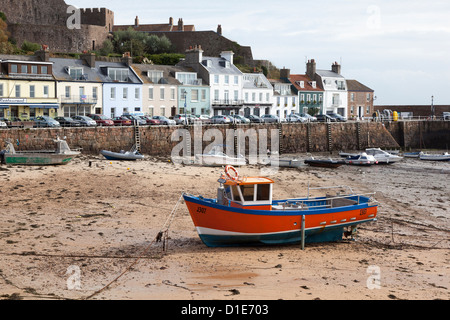 Fishing boat on beach, Gorey harbour, Mont Orgueil Castle, Gorey, Jersey, Channel Islands, UK Stock Photo