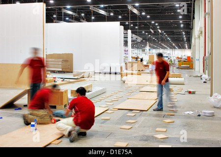 All hands on Deck and the construction workers assemble the exhibition panels Stock Photo