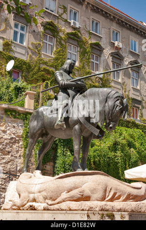 St. George and the Dragon bronze statue in Zagreb, Croatia. Located near Stone Gate, the old entrance gate to the Gradec. Stock Photo