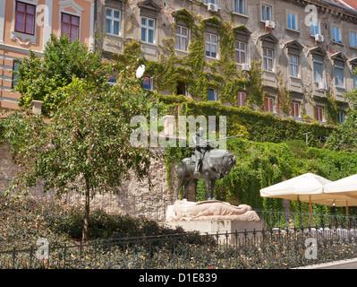 St. George and the Dragon bronze statue in Zagreb, Croatia. Located near Stone Gate, the old entrance gate to the Gradec. Stock Photo