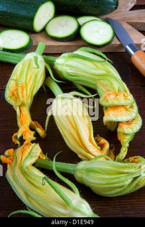 Courgette flowers and sliced courgette, Italy, Europe Stock Photo