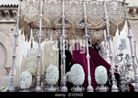 Virgin Mary on a platform in Palm Sunday procession during Holy Week (Semana Santa) in Cordoba, Spain.