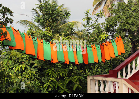 Grenada. Close-up of washed sports team vests on a line. Stock Photo