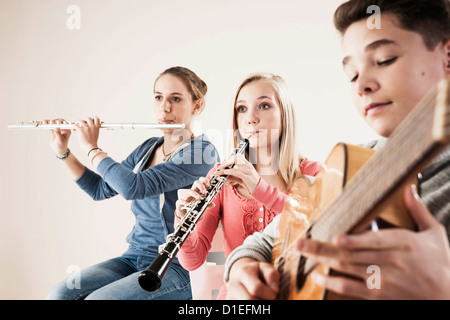 Teenager playing music Stock Photo