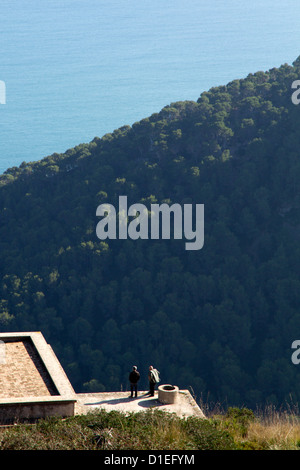 Two man speaking on panoramic site Formentor Tramuntana Mallorca Majorca Balearic islands Spain Mediterranean Stock Photo