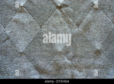 Knitted wool pattern rhomb form grey color background Stock Photo