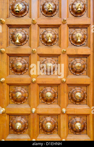 Wooden temple door with bells in Hindu temple Stock Photo