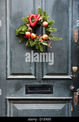 A classic Christmas wreath on a old Victorian door Stock Photo