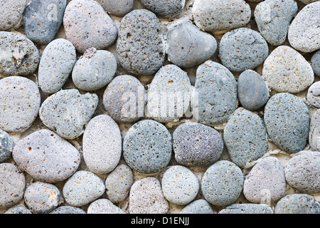 Grey peddle stone wall background Stock Photo