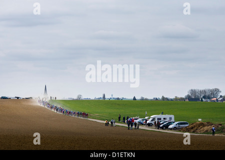 Pack of cyclists round a bend during the Paris - Roubaix cycling race, Northern France Stock Photo