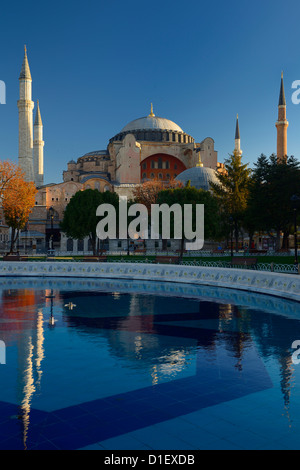 Early morning sun on the Hagia Sophia with reflection in fountain Istanbul Turkey Stock Photo