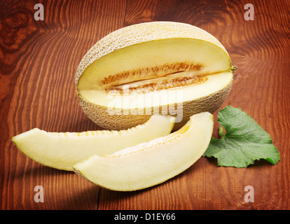 melon of yellow color and worn table Stock Photo