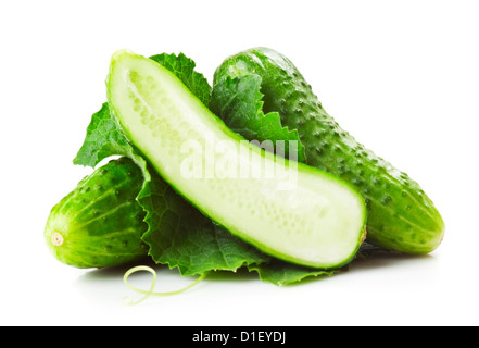 Heap of fresh green cucumbers with leaf and yellow flowers. Placed on white background. Close-up Stock Photo