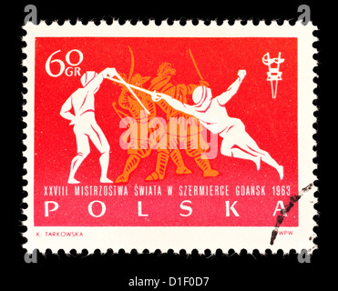 Postage stamp from Poland depicting fencers. Stock Photo