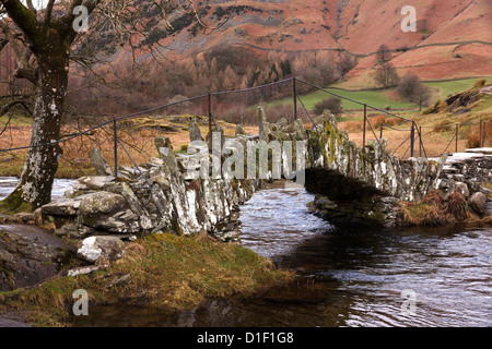 Slater bridge, old stone pack horse bridge over river Brathay in Little Langdale, Lake District, Cumbria, England, UK