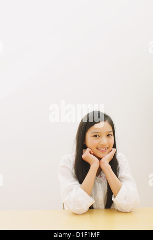 Girl in pre-adolescent age smiling at camera Stock Photo