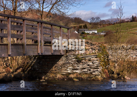 Wooden footbridge over River Brathay in Little Langdale, Lake District, Cumbria, England, UK