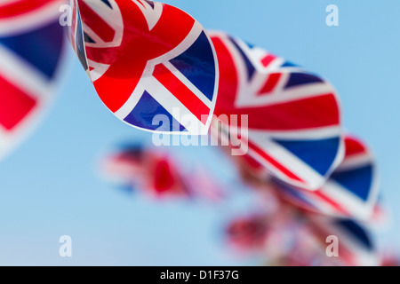 Union Jack bunting blowing in the breeze at a Diamond Jubilee celebration in June 2012, Northumberland, England Stock Photo