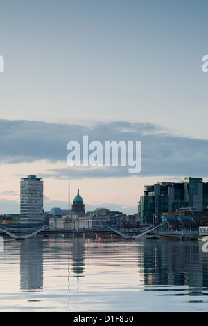 Moody image of Dublin skyline reflected in River Liffey Stock Photo