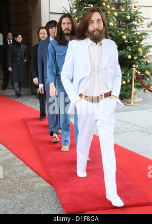 Wax figures of John Lennon (r-l), George Harrison, Paul McCartney and Ringo Starr as Abbey Road Beatles stands at the Hotel Adlon in Berlin, Germany, 18 December 2012. Fifty years ago, the Beatles released their very first single. On this occasion, Madame Tussaouds presents the Abbey Road beatles as wax figures. Until the end of the year, all visitors who will trade in an original beatles ep get free admission to the show. Photo: STEPHANIE PILICK Stock Photo