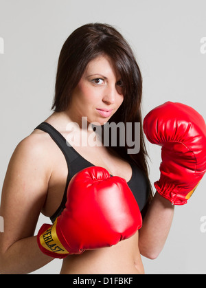 Young woman with boxing gloves Stock Photo
