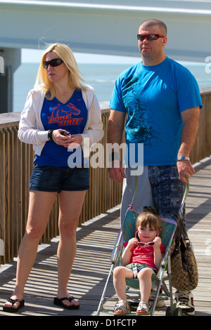 Family on the boardwalk at Johns Pass Village located on the waterfront at Madeira Beach, Florida, USA. Stock Photo