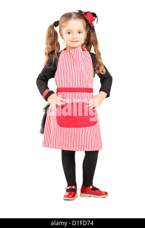 Full length portrait of a smiling girl wearing apron and posing isolated against white background