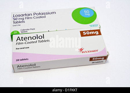 Photograph of Atenolol a beta blocker and Losartan Potassium tablets a drug to treat high blood pressure both are prescribed in the UK, Stock Photo