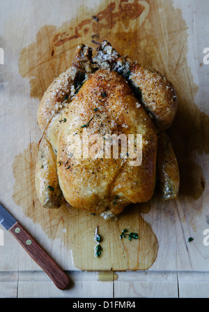 Roast chicken on cutting board