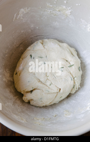 Rosemary bread dough in bowl